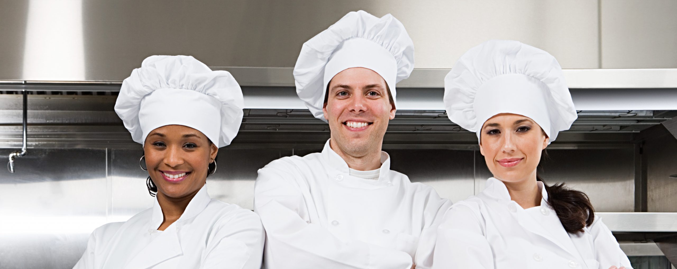 Three chefs smiling